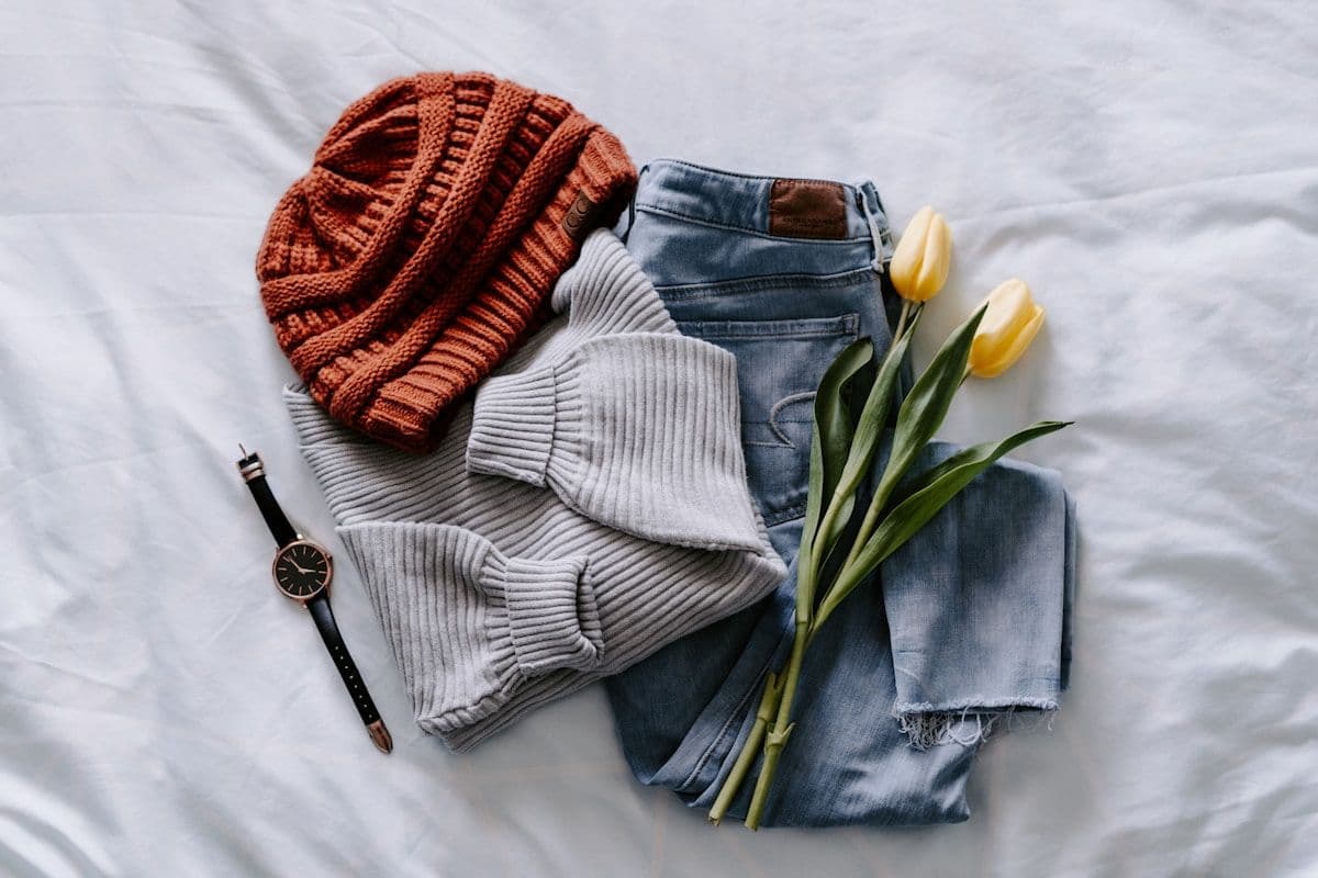 Folded apparel basics on a retail shelf, the kind of inventory data a DTC ecommerce team reviews when analyzing returns and sizing